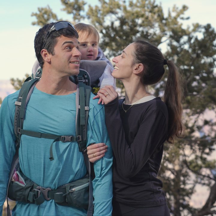 Shir and her husband smiling at each other at the Grand Canyon